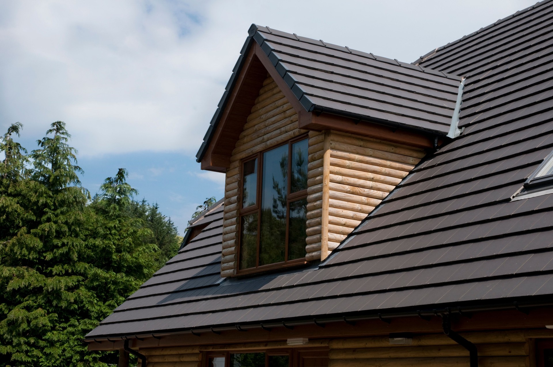 Dormer window on a log cabin